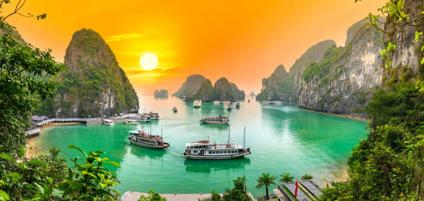 Dreamy sunset landscape Halong Bay, Vietnam Dreamy sunset landscape Halong Bay, Vietnam view from adove. This is the UNESCO World Heritage Site, a beautiful natural wonder in northern Vietnam gulf of tonkin photos stock pictures, royalty-free photos & images