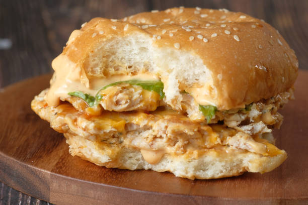 istock half eaten beef burger on table close up 1290791465