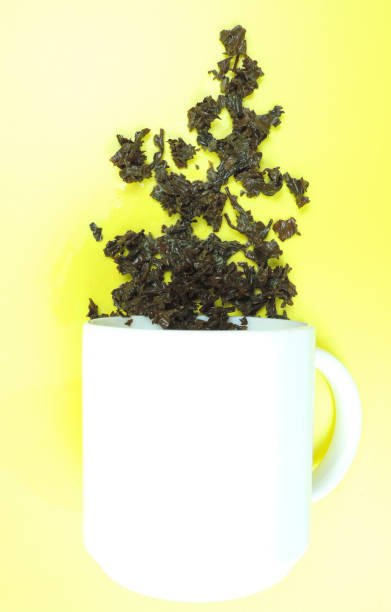 istock used tea leaves and inverted cup 1290794675