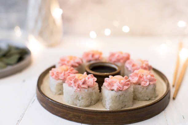istock Sushi roll with pink cream, salmon 1290807408