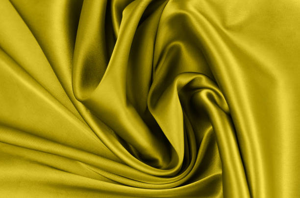 istock Beautiful fabric background in trendy yellow color. 1290809059
