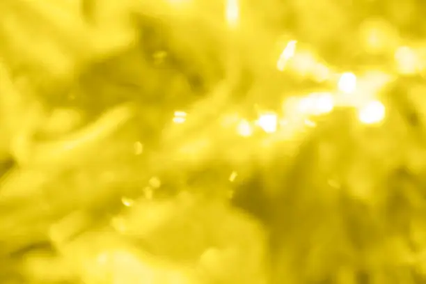 Photo of Blurred abstract background of trending yellow color.