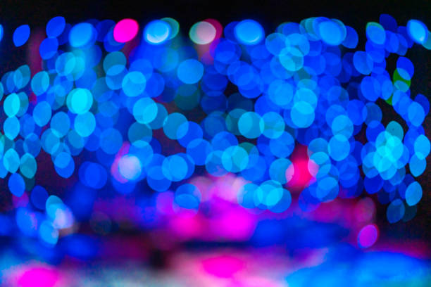 istock abstract blur bokeh dramatic spot light with smoke effect on stage performance show 1290811054