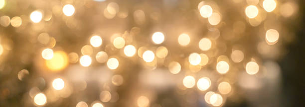 abstracto borro oro brillo brillo fondo festivo concepto de fondo - iluminado fotografías e imágenes de stock