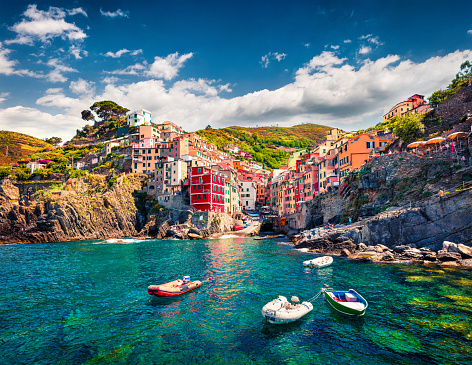 First city of the Cinque Terre sequence of hill cities - Riomaggiore. Colorful morning view of Liguria, Italy, Europe. Great spring seascape of Mediterranean sea. Traveling concept background.