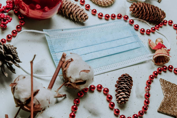 istock medical mask among christmas decorations 1290816977