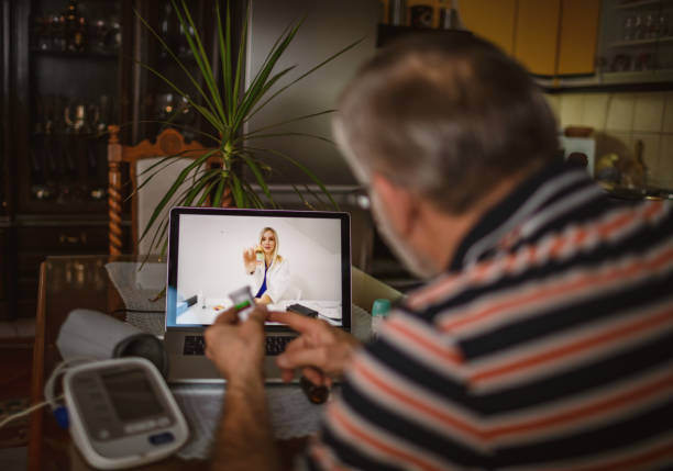 istock Senior Man consulting with doctor online 1290817124