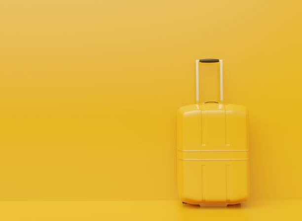 istock Large suitcase yellow colors 1290828579