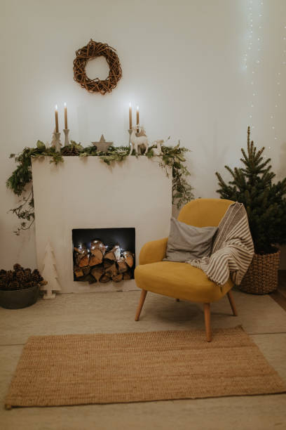 istock Design room with Christmas tree, fireplace. Interior eco style. Christmas decorated interior of couch and Christmas tree, modern and cozy. happy new year and merry christmas 1290828938