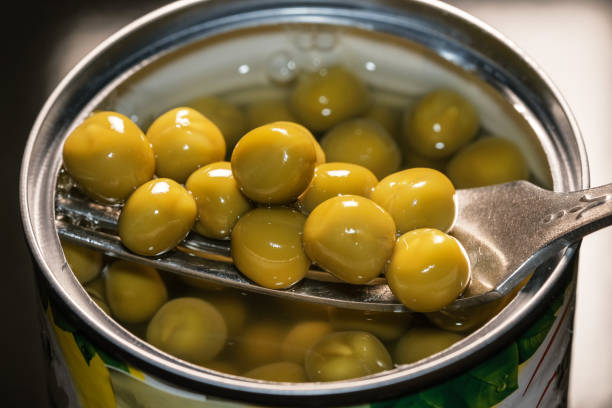 istock Canned young green peas 1290829826