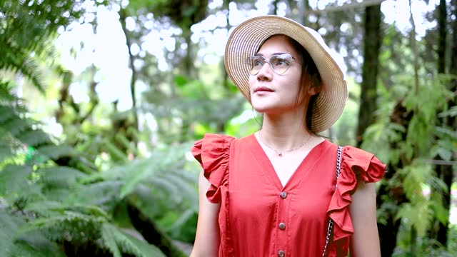 Girl in red dress Walking in the forest