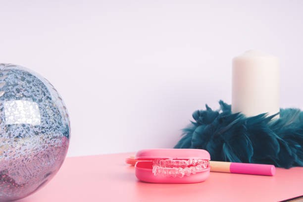 istock Fancy colourful toothbrushes and invisible dental aligners 1290833526