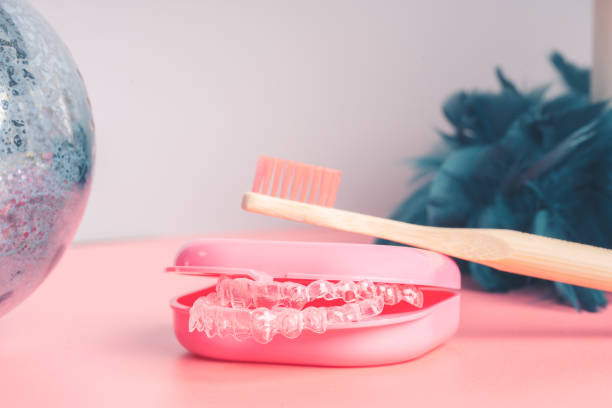 Fancy colourful toothbrushes and invisible dental aligners