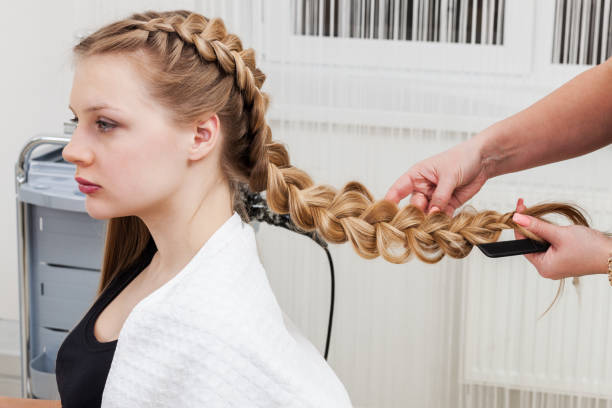 istock weave braid girl in a hair salon 1290834327
