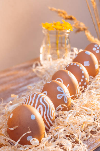 istock Very simple painted with natural white paint Easter eggs in sunlight 1290834637