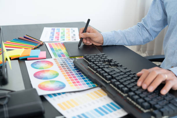istock interior designer or creative graphic designer working on project architectural with colour samples with work tools and equipment for selection in office. 1290836444