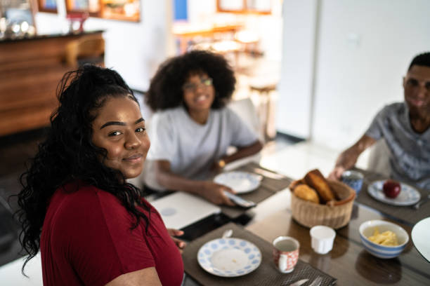 istock Portrait of young adults taking breakfast together 1290836458