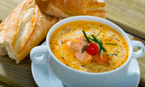 istock Creamy salmon soup with baguette 1290836664