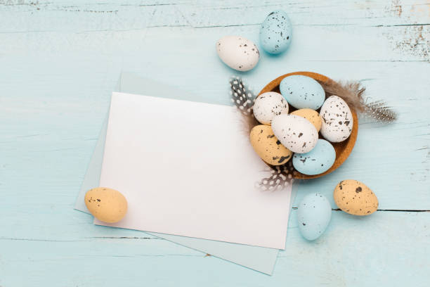istock Easter craft eggs and branches on blue pastel background with space for text. Flat lay image composition, top view. 1290836915