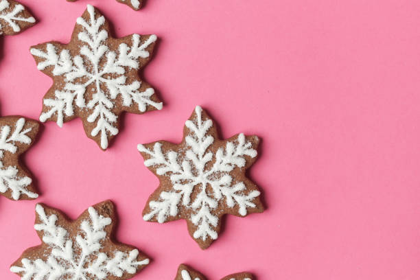 istock Snowflake gingerbread cookies on pink background. 1290838885