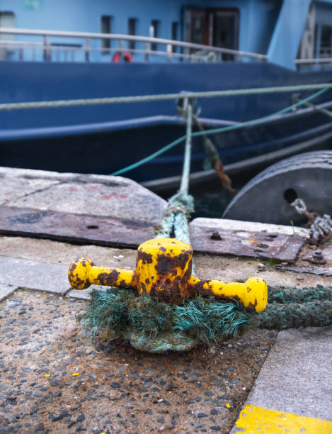 istock bollard and rope on the pier, makefast, 1290839669
