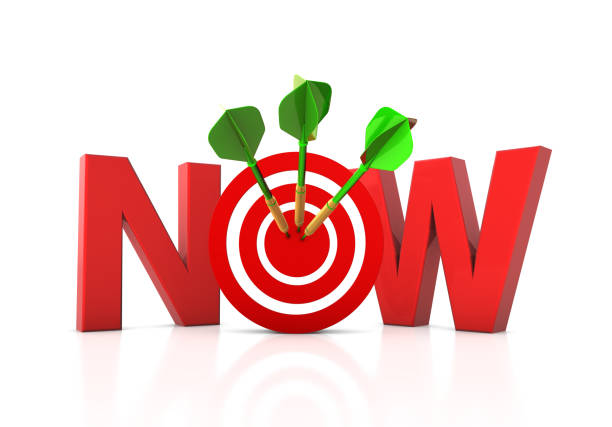 istock NOW 3D Word with Target and Dart 1290840544