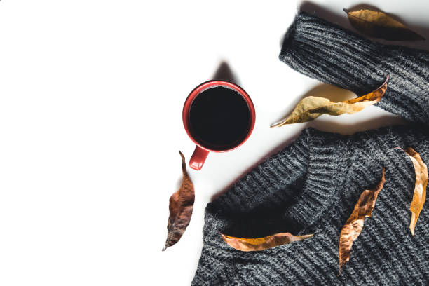 istock Autumn composition. Cup of coffee, sweater on white background. Autumn, fall concept. 1290840685