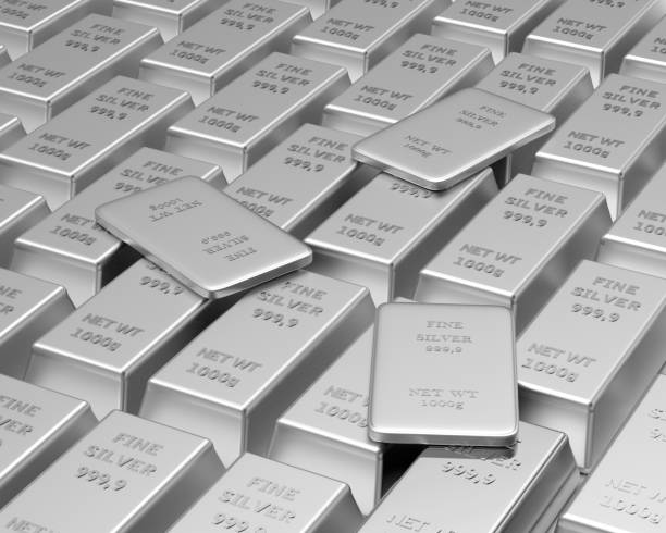 istock Rows of silver bars with a few thin bars on top. 1290842951