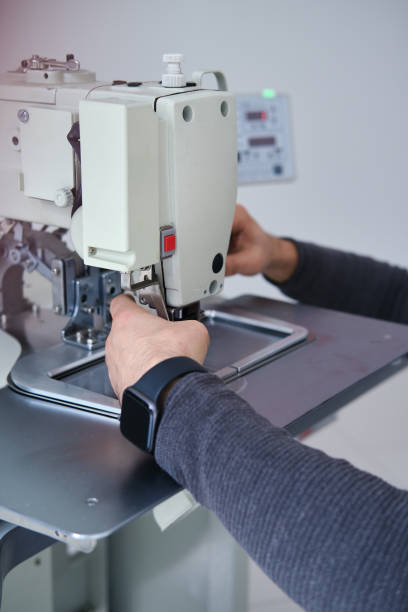 istock Industrial sewing machine repairing 1290843139