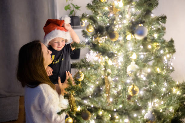 istock A mother and a son near a Christmas tree 1290846975