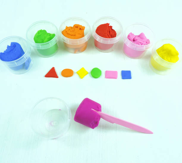 istock colored mass for modeling, plasticine for children's creativity, the child makes colored geometric shapes, 1290849963