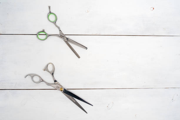 istock Hairdressing tools on a wooden background with copy space 1290850779