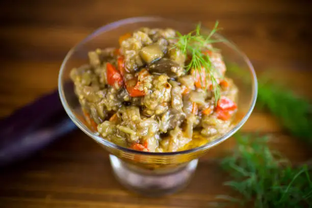 Photo of cooked eggplant summer caviar with vegetables in a bowl