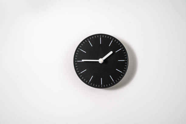 istock close up of an office clock on white background with clipping path 1290855994