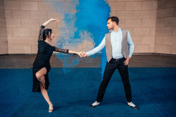 istock Man and woman dancing on stage 1290856032