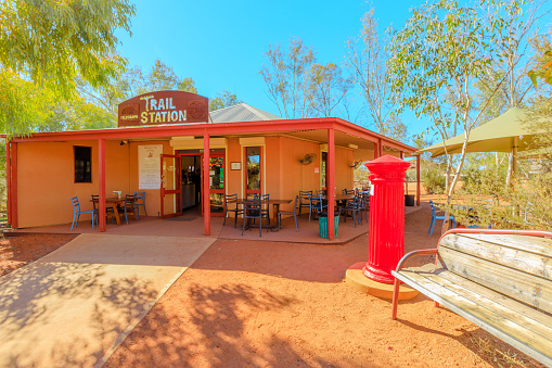 Alice Springs, Northern Territory, Australia - Aug 14, 2019: Alice Springs telegraph station with red mailbox of post office. Historic landmark in Alice Springs, Northern Territory, Central Australia.