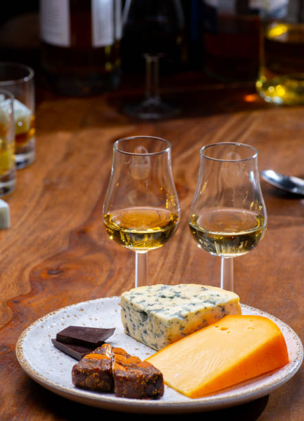 istock Tasting and pairing of different cheeses with strong alcoholic drinks, whisky, cognac or calvados 1290857181