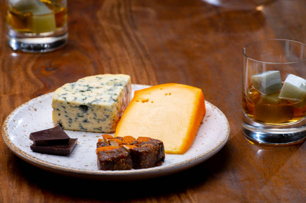istock Tasting and pairing of different cheeses with strong alcoholic drinks, whisky, cognac or calvados 1290857183