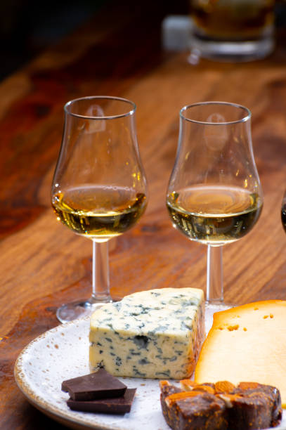 istock Tasting and pairing of different cheeses with strong alcoholic drinks, whisky, cognac or calvados 1290857188
