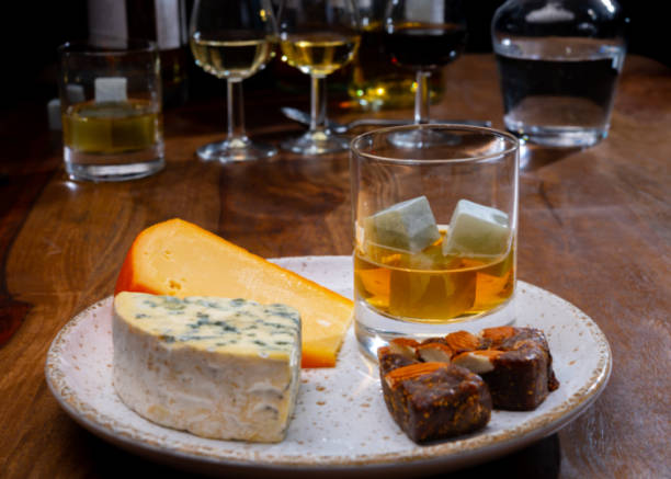 istock Tasting and pairing of different cheeses with strong alcoholic drinks, whisky, cognac or calvados 1290857194