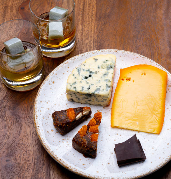istock Tasting and pairing of different cheeses with strong alcoholic drinks, whisky, cognac or calvados 1290857196