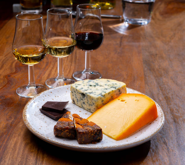 istock Tasting and pairing of different cheeses with strong alcoholic drinks, whisky, cognac or calvados 1290857198