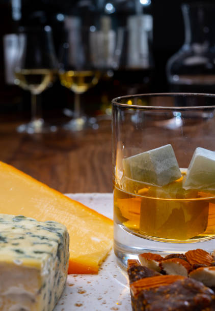 istock Tasting and pairing of different cheeses with strong alcoholic drinks, whisky, cognac or calvados 1290857204