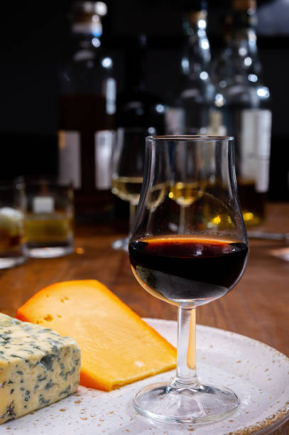 istock Tasting and pairing of different cheeses with strong alcoholic drinks, whisky, cognac or calvados 1290857210