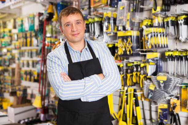 istock Male seller with tools in store 1290857436