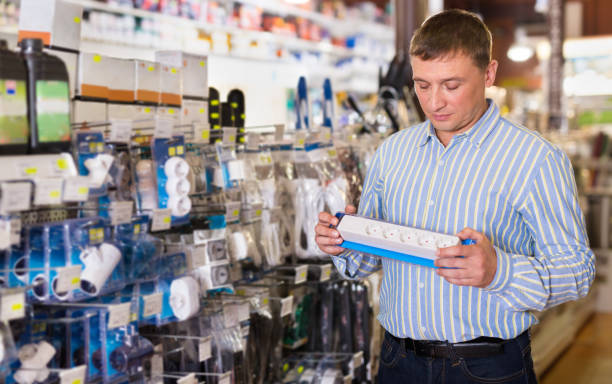 istock Man chooses electrical parts in store 1290857447