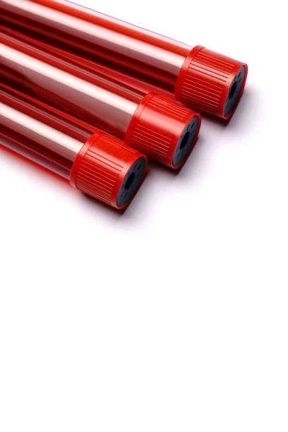 istock Test tubes with red plug isolated on white background 1290859144