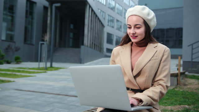 Brunette business woman laptop outside in beautiful style on business center