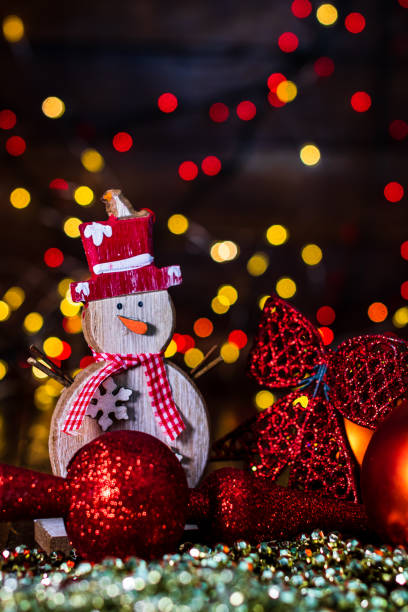 istock Decorations and ornaments in a colorful Christmas composition isolated on background of blurred lights. 1290860662