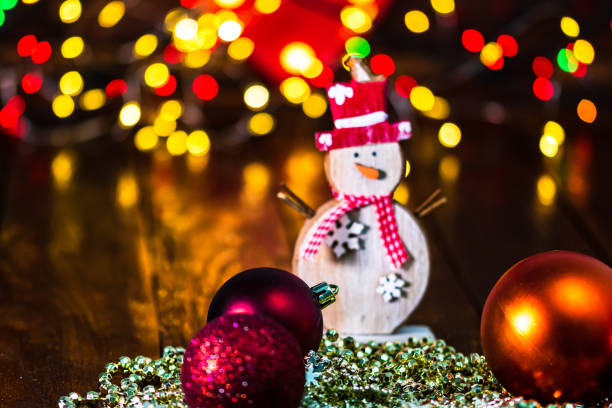 istock Decorations and ornaments in a colorful Christmas composition isolated on background of blurred lights. 1290861591